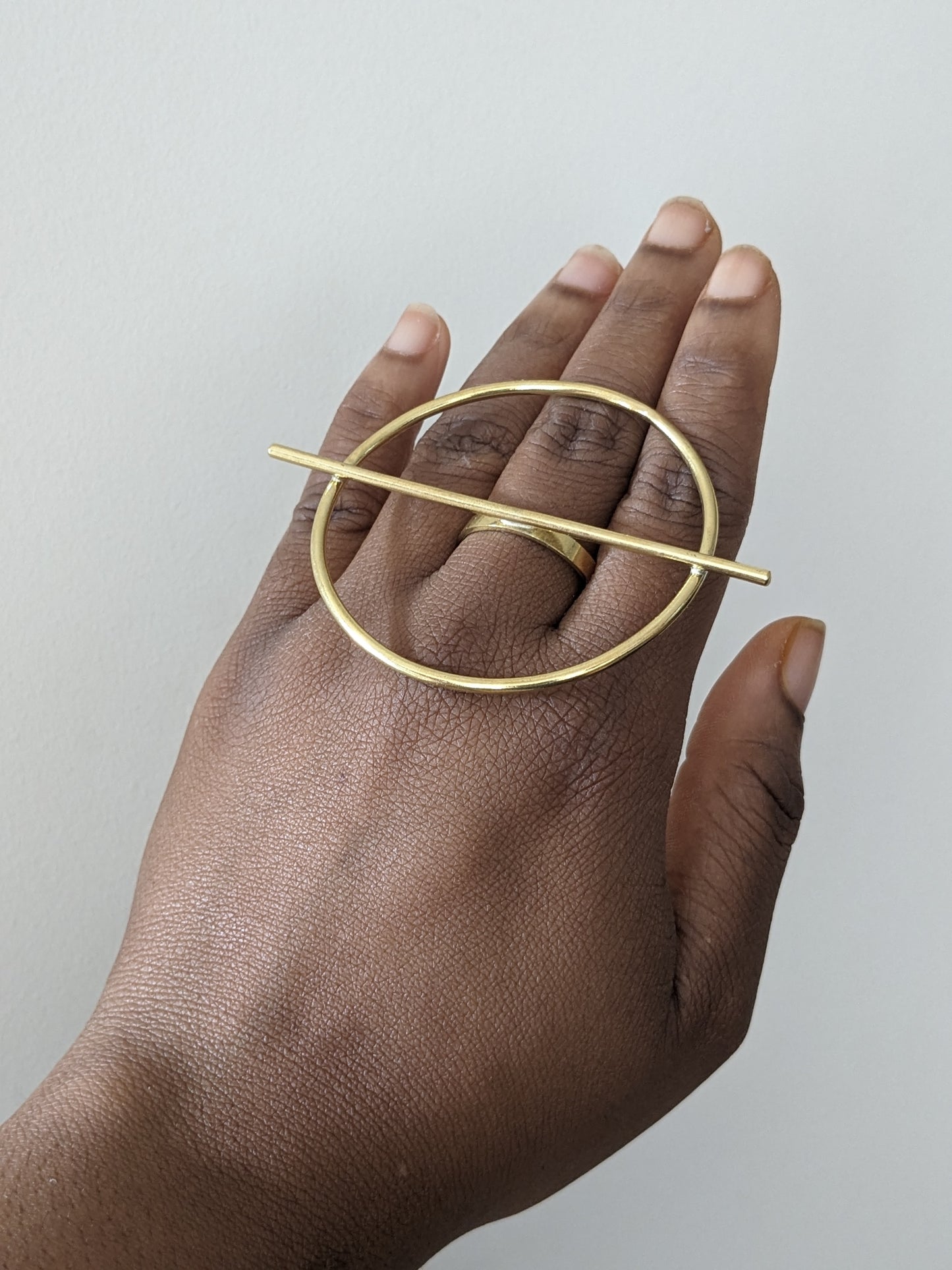 gold circle and bar statement ring