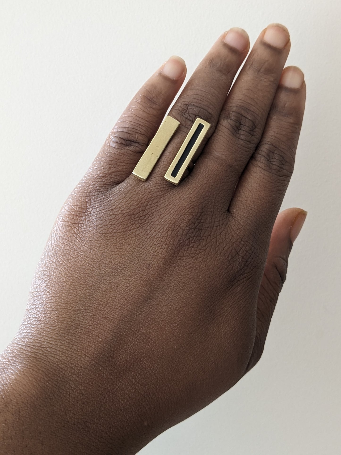 Gold bar and black enamel ring