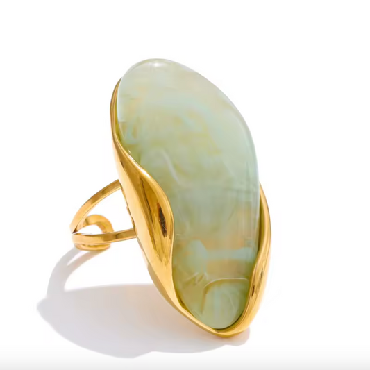 Gold ring with a large, oval, light green stone