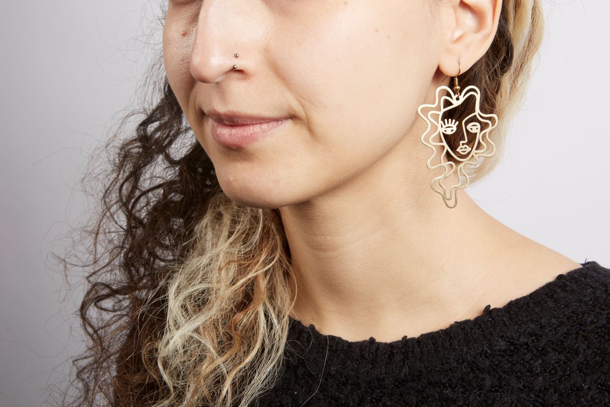 face dangle earrings