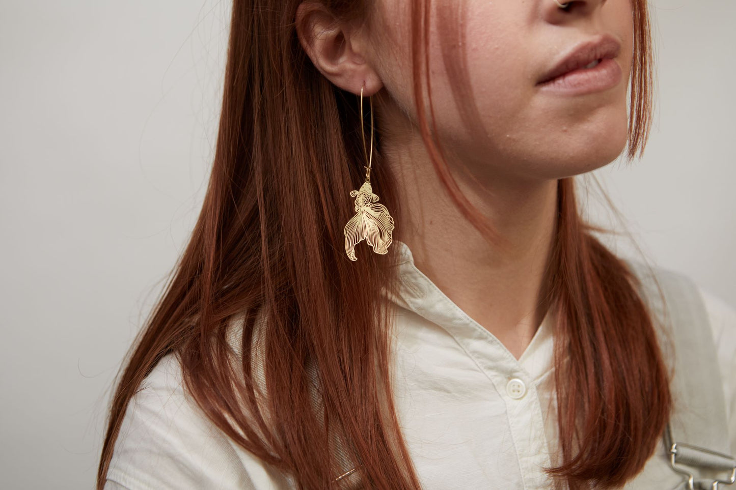 Gold fish dangle earrings