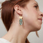 green dangle earrings